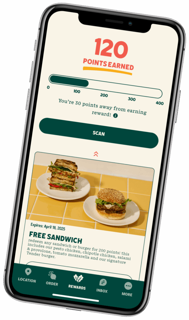 smartphone displaying points being earned on the Tender Rewards app